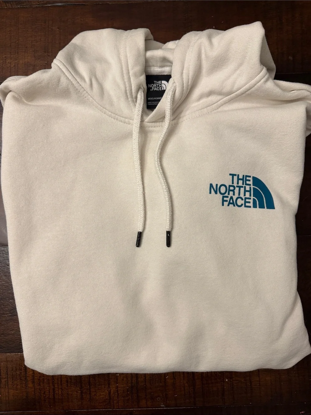 The North Face Men's Cream Hoodie with Blue Logo